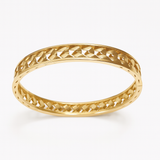 Złota szeroka ażurowa bransoletka mankietowa