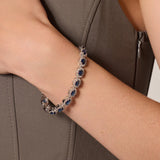 Bransoletka srebrna z błyszczącymi granatowymi cyrkoniami