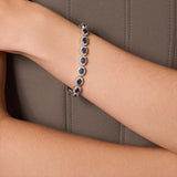 Bransoletka srebrna z błyszczącymi granatowymi cyrkoniami