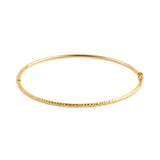 Złota bransoletka sztywna z ozdobnym grawerem