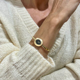 Zegarek złoty z czarną tarczą