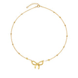 Pozłacany naszyjnik z kokardą i kulkami