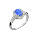 Pierścionek srebrny z owalnym niebieskim opalem i cyrkoniami