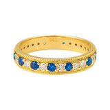 Złoty pierścionek z granatowymi cyrkoniami