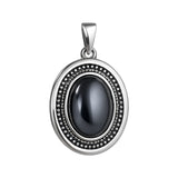 Zawieszka srebrna duża z hematytem w grawerowanej oprawie